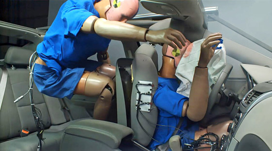 Image: A sled test simulating 35 mph frontal crash with the back seat passenger without a belt.