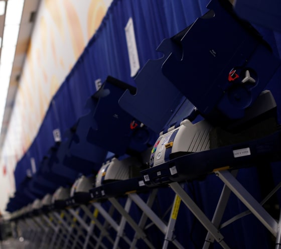 Image: A row of voting booths is seen at a polling station during early voting in Chicago