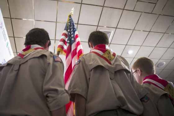 Image: Boy Scouts stand on stage with a U.S. flag during the Pledge of Allegiance, April 12, 2014.