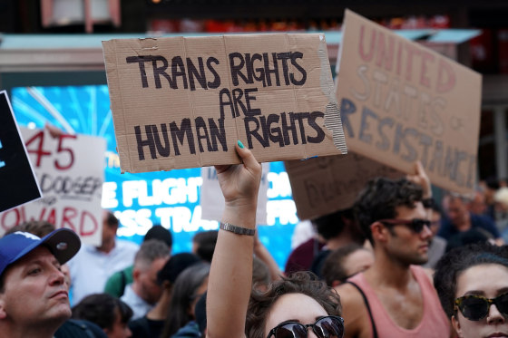 Image: FILE PHOTO: People protest Trump's announcement that he plans to reinstate a ban on transgender individuals from serving in any capacity in the U.S. military, in Times Square