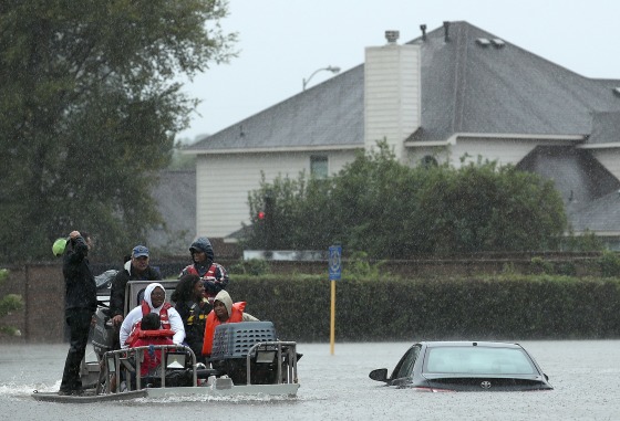 Image: Residents are evacuated from their homes after severe flooding