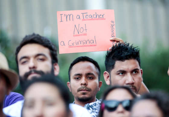 Image: Milton Flores, a Deferred Action for Childhood Arrivals (DACA) program recipient stands with supporters during a rally outside the Federal Building in Los Angeles