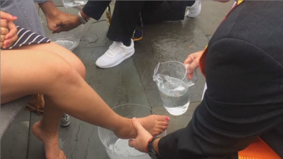 The Rev. Randy Mayer, senior minister of The Good Shepherd UCC in Sahuarita, Ariz., washes the feet of DACA recipient at a news conference at the Capitol on Sept. 13, 2017.