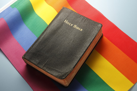 Bible On Top Of Rainbow Flag