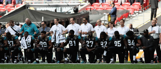 Jacksonville Jaguars players kneel during the national anthem as they prepared to play against the Baltimore Ravens at Wembley Stadium in London, England, on Sunday.