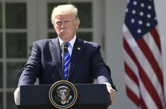 Image: President Donald Trump listens during a joint press conference