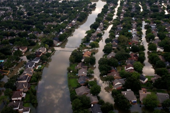 Image: FILE PHOTO: Houses are seen partially submerged in flood waters caused by Tropical Storm Harvey in Northwest Houston