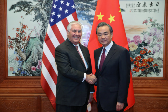 Image: U.S. Secretary of State Rex Tillerson (L) shakes hands with Chinese Foreign Minister Wang Yi (R) before their meeting at the Great Hall of the People in Beijing