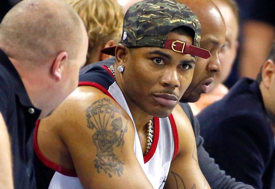 Image: Recording artist Nelly watches the game between the New York Knicks and the Charlotte Bobcats during an NBA basketball game in Charlotte, North Carolina, April 15, 2013.