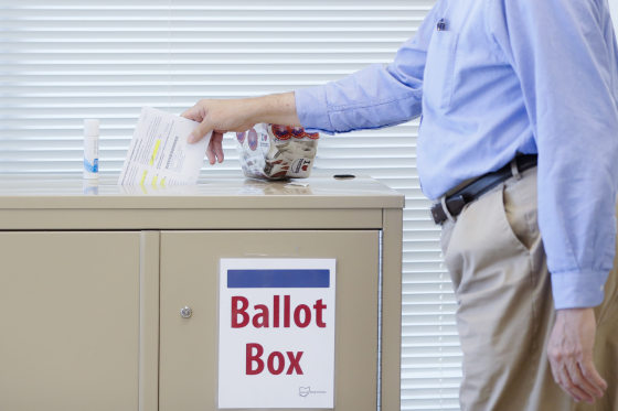 A voter casts a ballot on the first day of early voting at the Hamilton County Board of Elections, Wednesday, Oct. 11, 2017, in Cincinnati. (AP Photo/John Minchillo)