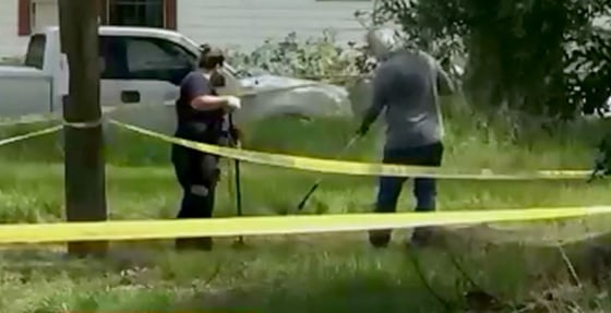 Image: A crime scene is investigated as part of a potential serial killer pattern in Tampa, Florida.