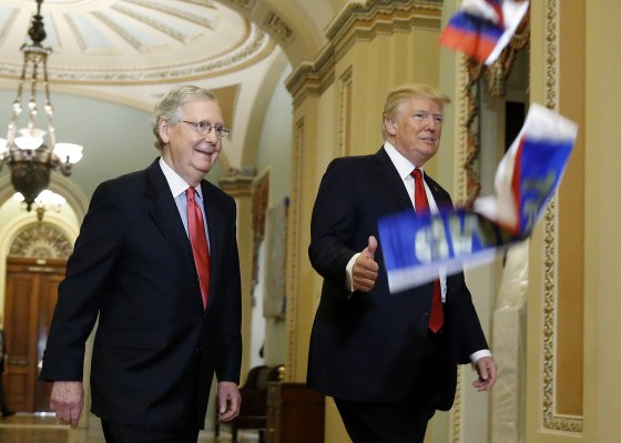 Image: U.S. President Trump walks with McConnell as he arrives for Senate Republican Policy Committee's weekly policy luncheon meeting on Capitol Hill in Washington