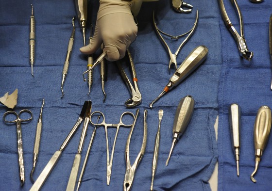 Image: A volunteers gets dental tools for dentists