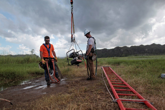 Image: Workers from Montana-based Whitefish Energy Holdings help fix the island's power grid, damaged during Hurricane Maria in September, in Manati