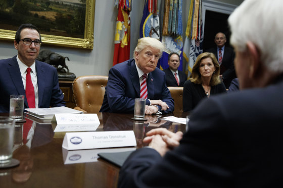 Image: Trump listens during a meeting on tax policy with business leaders