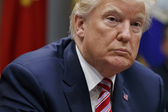 Image: Trump listens during a meeting on tax policy