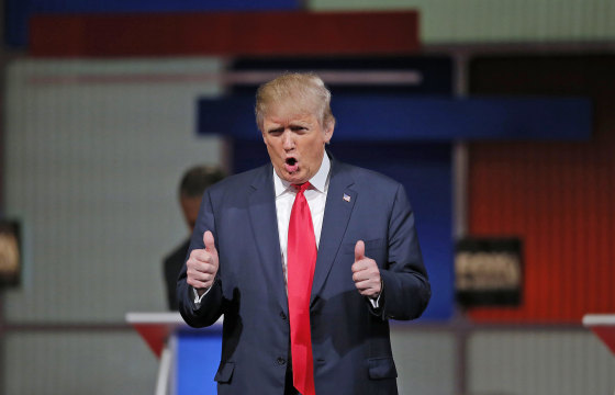 Republican U.S. presidential candidate and businessman Donald Trump gives a thumbs up to the crowd during the Fox Business Network Republican presidential candidates debate in North Charleston
