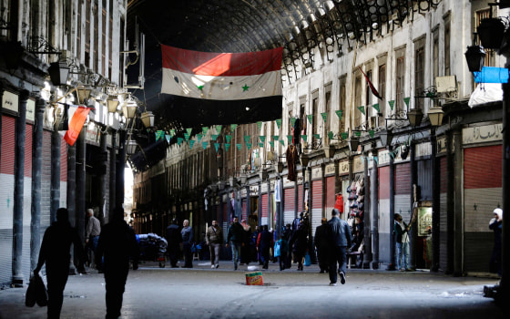 Image: Syrian vendors open their shops at the Hamidiya market