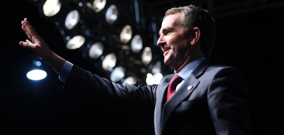 Image: Democratic Gubernatorial Candidate Ralph Northam waves as he arrives to speak during a campaign rally