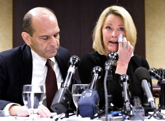 Image: Former Boston news anchor Heather Unruh sits with her attorney Mitchell Garabedian at a press conference in Boston