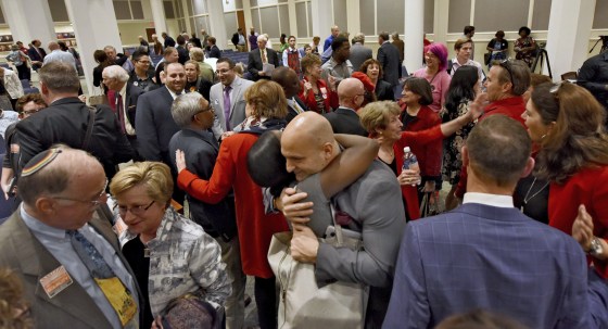 Image: Duval Schools Superintendent Nikolai Vitti is hugged after the city council voted 12-6 to support the Human Rights Ordinance in Jacksonville