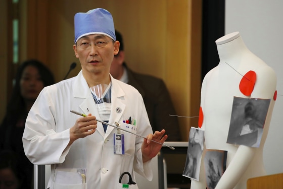 Image: South Korean doctor Lee Cook-Jong speaks about the condition of the North Korean soldier who defected and was found to have parasites in his gut.
