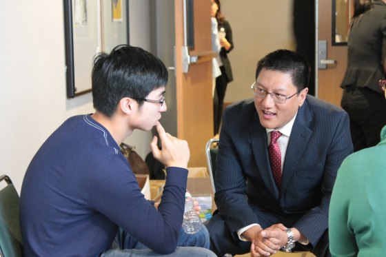 Steven Ma answers a high school student's question following one of his seminars.