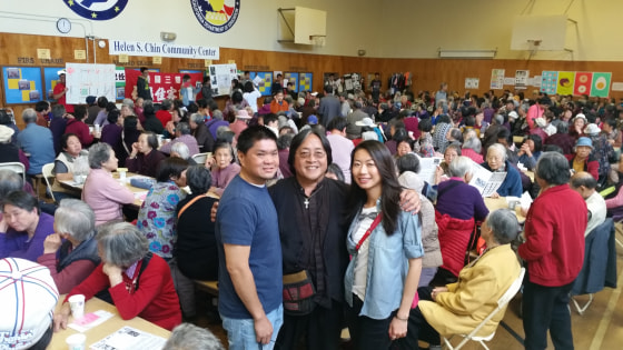Rev. Norman Fong with youth volunteers at a Chinatown CDC Super Sunday gathering.