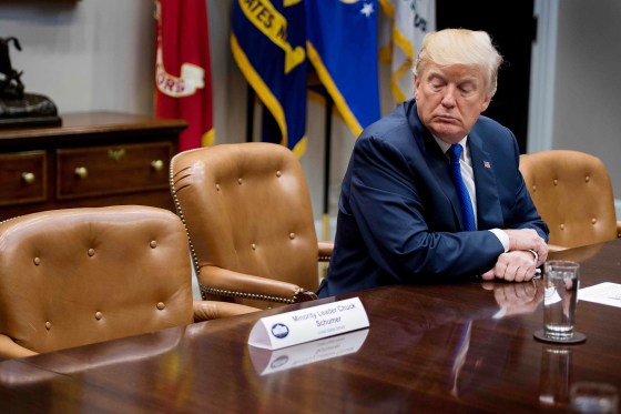 Image: US President Donald Trump looks at the empty chair of Senate Minority Leader Chuck Schumer