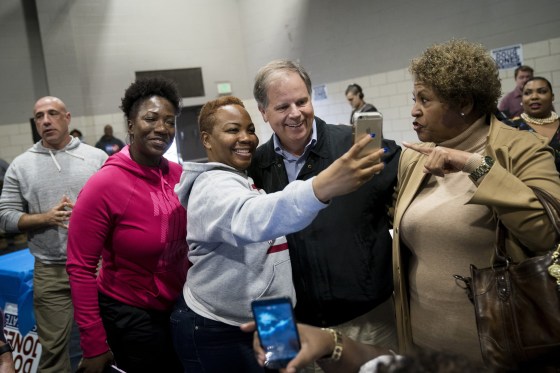 Image: Doug Jones takes photos with supporters