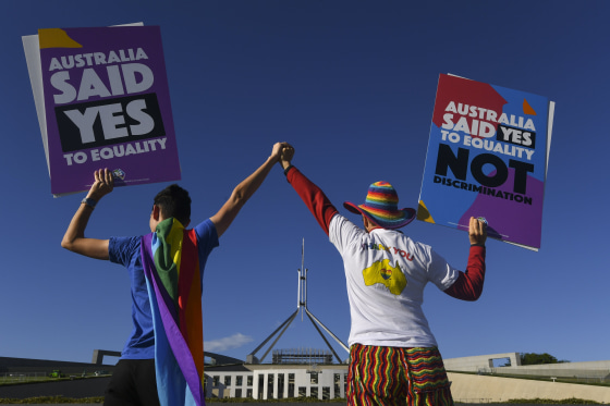 Image: Same-sex marriage campaigners in equality rally outside Parliament House in Canberra