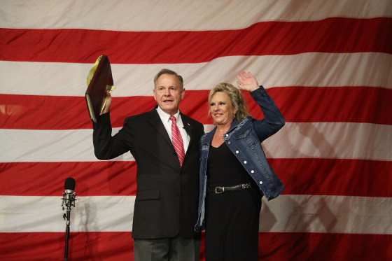 Image: Republican Senatorial candidate Roy Moore stands with his wife Kayla Moore during a campaign event at Oak Hollow Farm on Dec. 5, 2017 in Fairhope, Alabama. Mr.