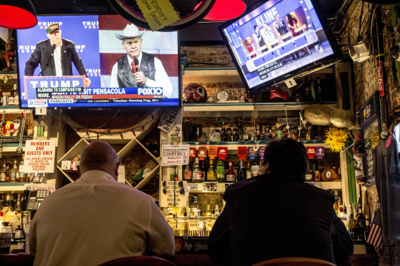 Image: A television at OK Bicycle Shop in Mobile airs a local Fox affiliate's story about the special election, announcing President Donald Trump's endorsement of Moore.