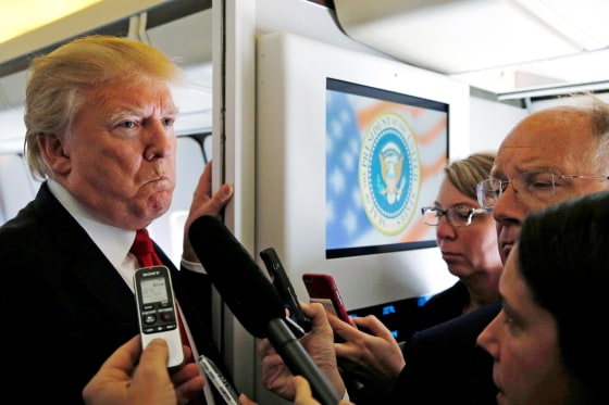 Image: Trump talks to reporters en route to Hanoi, Vietnam