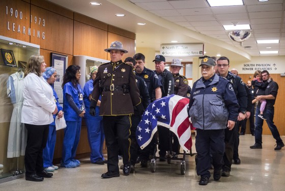 Image: Officers and medical staff take part in a procession for officer Daniel McCartney, of Yelm, at St. Joseph Medical Center in Tacoma, Washington, on Jan. 8, 2018.