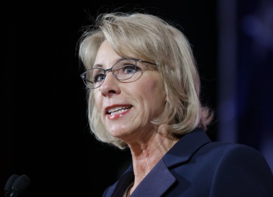 In this Oct. 13, 2017 file photo, U.S. Education Secretary Betsy DeVos speaks during a dinner hosted by the Washington Policy Center, in Bellevue, Wash. The U.S. Commission on Civil Rights says inequality and segregation persist in American schools. A study by the commission finds that low-income, black and Latino students too often end up in schools with crumbling walls, old textbooks and unqualified teachers. The commission is calling for a boost in federal education spending, changing school funding models and investing in housing.
