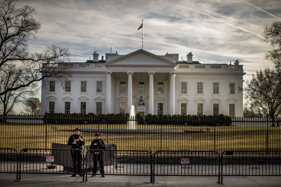 Image: Police stand guard in front of the White House as the second annual Women's March gets underway in Washington, DC, on Jan. 20, 2018.