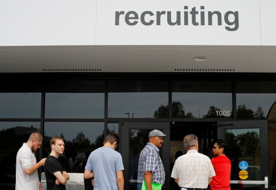Image: Job seekers line up to apply during \"Amazon Jobs Day\" at the Amazon.com Fulfillment Center in Fall River