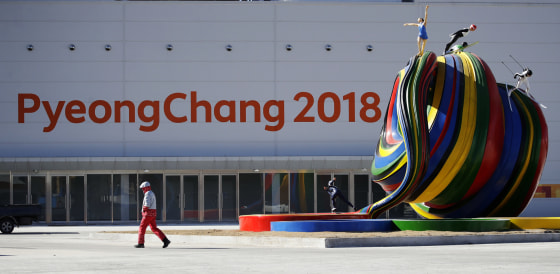 Image: A volunteer walks by the Pyeongchang Olympic Plaza