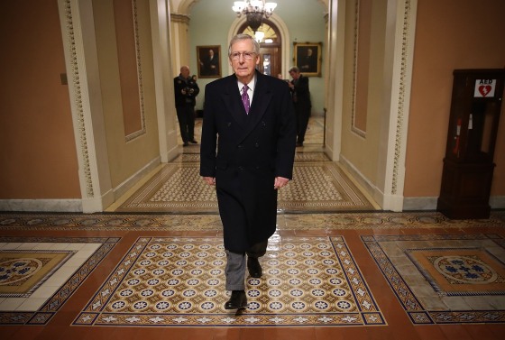 Image: Senate Majority Leader Mitch McConnell (R-KY) returns to the U.S. Capitol just before midnight on Feb. 8, 2018 in Washington, DC.