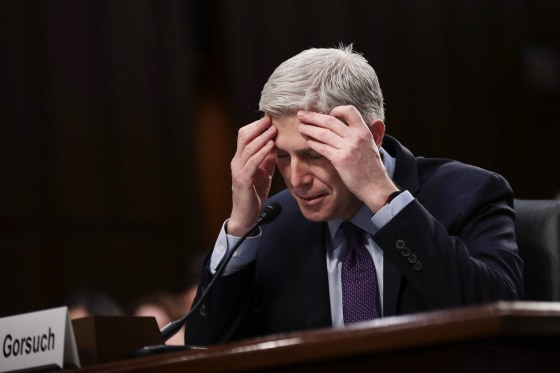 Image: Judge Neil Gorsuch pauses while testifying during second day of his Supreme Court confirmation hearing
