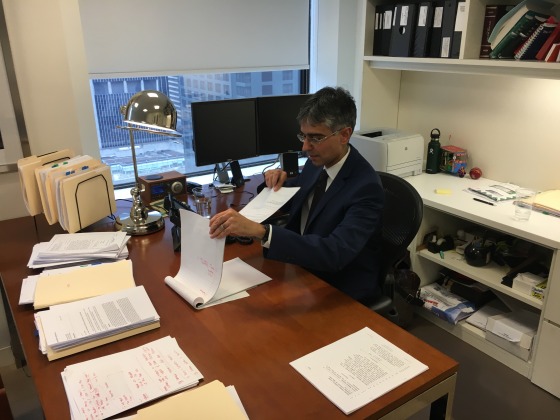 Adeel A. Mangi at his desk at the law firm Patterson Belknap Webb & Tyler, where he is a litigation partner.