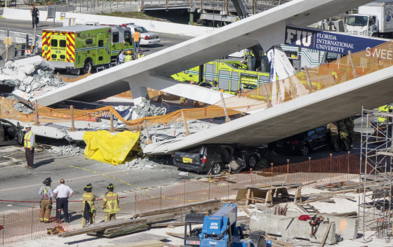 Image: A pedestrian bridge collapses crushing vehicles underneath in Miami