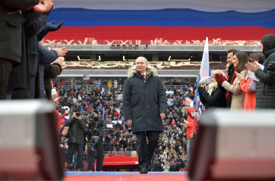 Image: Russian President Putin arrives to take part in a rally to support his bid in the upcoming presidential election, at Luzhniki Stadium in Moscow