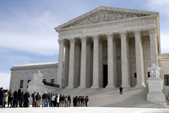 Image: People stand in line to enter the Supreme Court