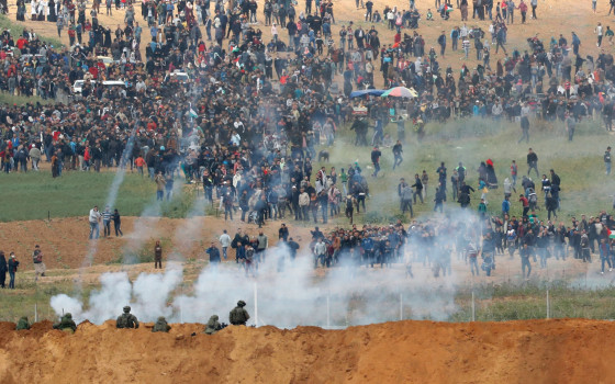 Image: Israeli forces shoot tear gas at Palestinian protesters along the Gaza - Israeli border fence
