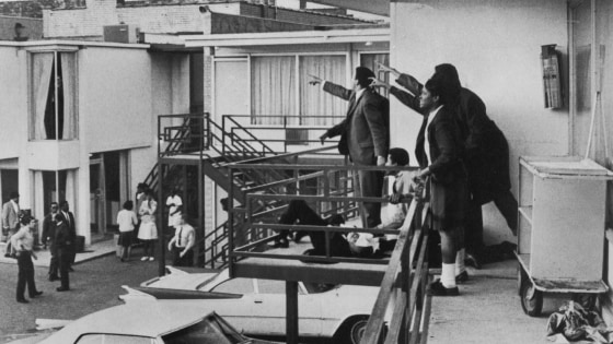 Associates of Martin Luther King Jr. point toward the sound where the gunfire originated just moments after his assassination at the Lorraine Motel on April 4, 1968, in Memphis, Tenn.