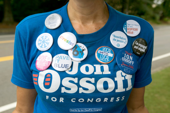 Image: Cherish Burnham of Roswell decorates her shirt with political buttons and shows her support of Democratic candidate Jon Ossoff