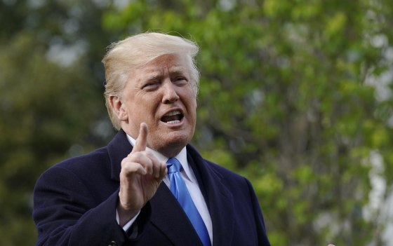 Image: President Donald Trump speaks during a tree planting ceremony with French President Emmanuel Macron on the South Lawn of the White House in Washington