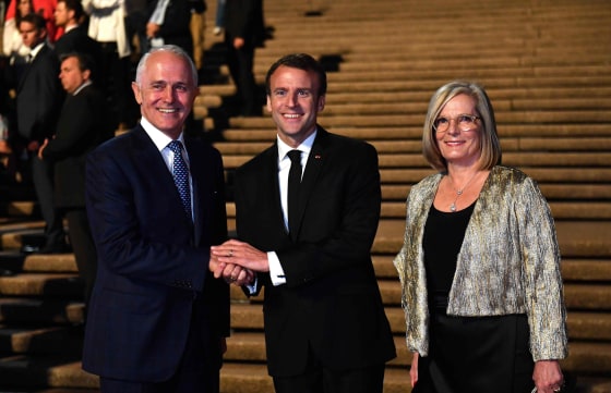 Image: France's President Emmanuel Macron with Australia's Prime Minister Malcolm Turnbull and his wife Lucy Turnbull